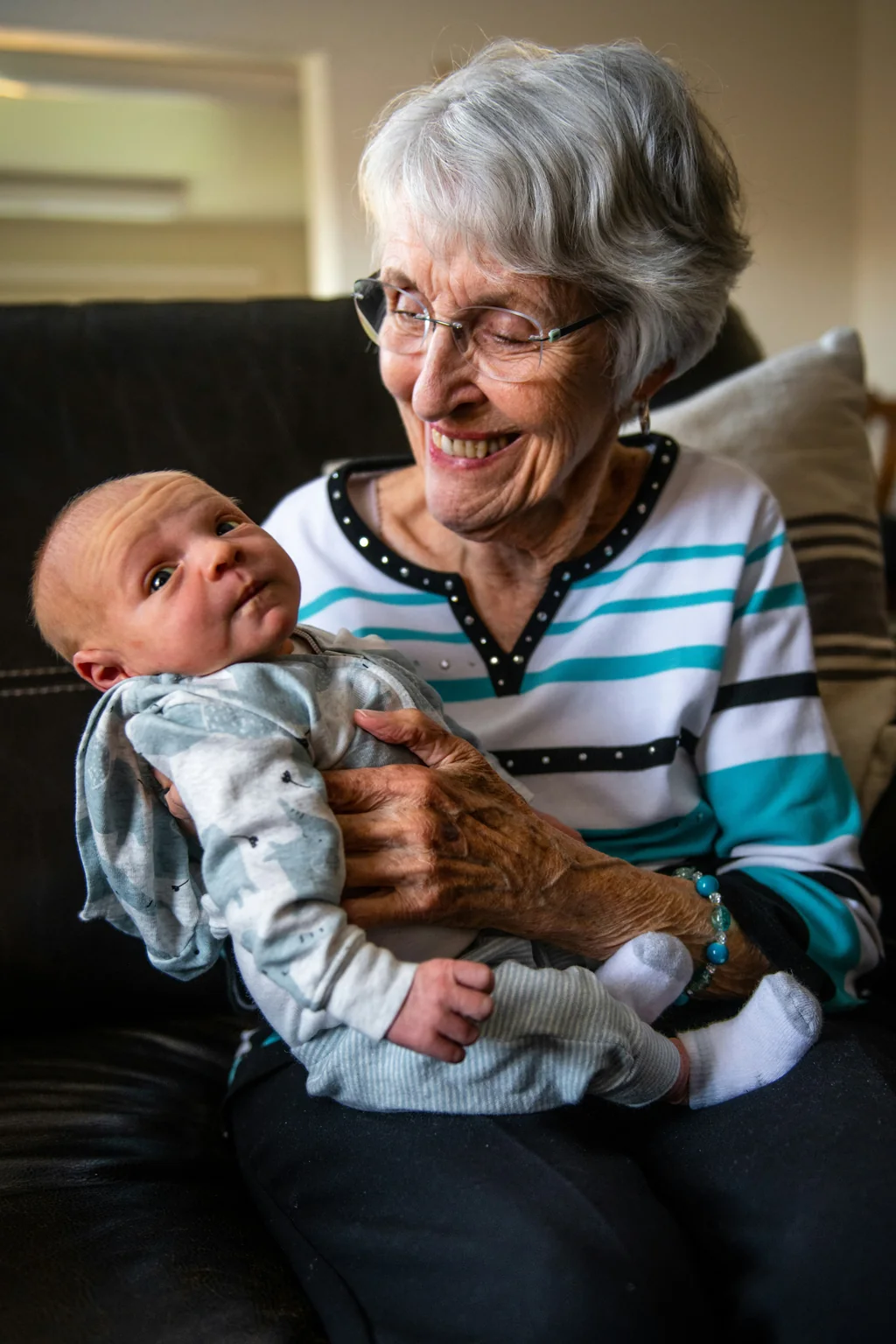 The Generation That Met in Art: How to Safely Place a Newborn Baby Beside a Late Grandparent in One Meaningful Frame